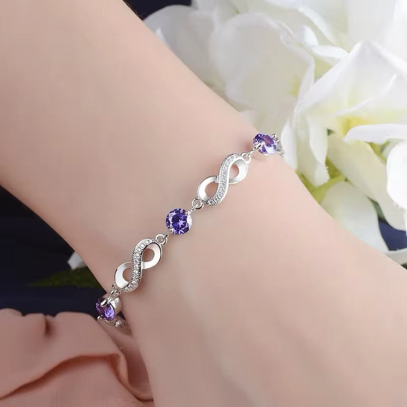 Pulsera Plata Esterlina 925 y Zircón, Color morado, Diseño infinito, Largo 16,5 cm y 4.5 cm. con extensión. Total 21 cm.